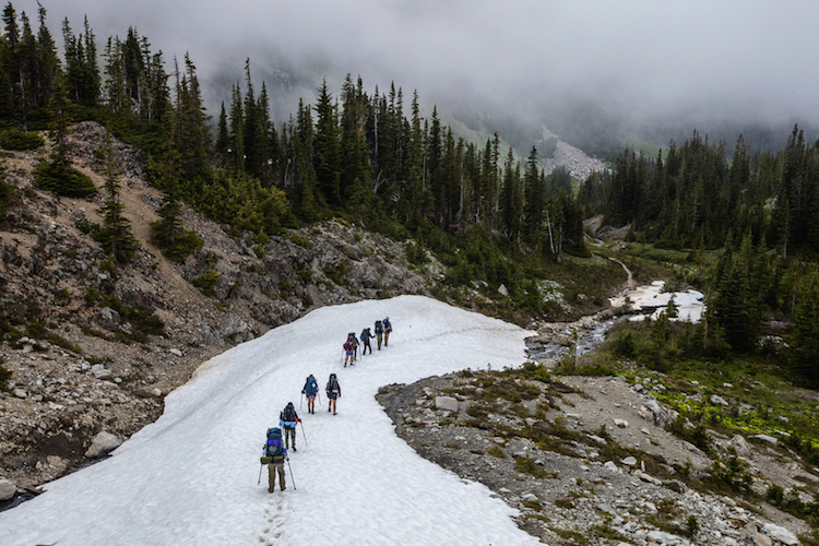 Environmental-studies students from the University of Washington and instructor Tim Billo make their way down into Grand Valley toward the end of their trek in the Olympic National Park backcountry.
