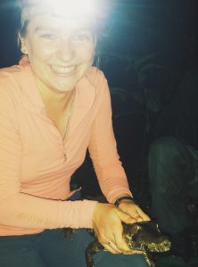 Danielle on a nightwalk in Peru, with a caiman.